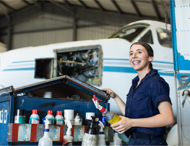 Female Engineer, repairing a plane